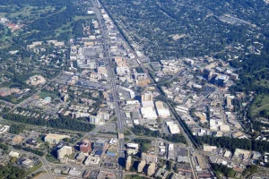 An aerial view of Twinbrook, MD showcasing its neighborhoods, streets, and surrounding greenery from above.